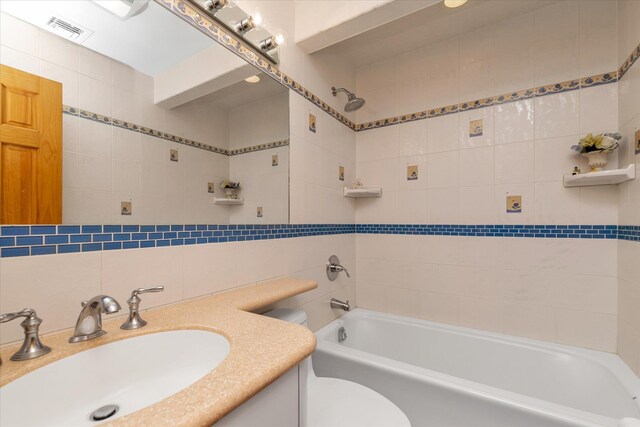 314 Oakview Ave, Oceanside, NY 11572 - full bath featuring tile walls, vanity, toilet, shower / bath combination, and backsplash