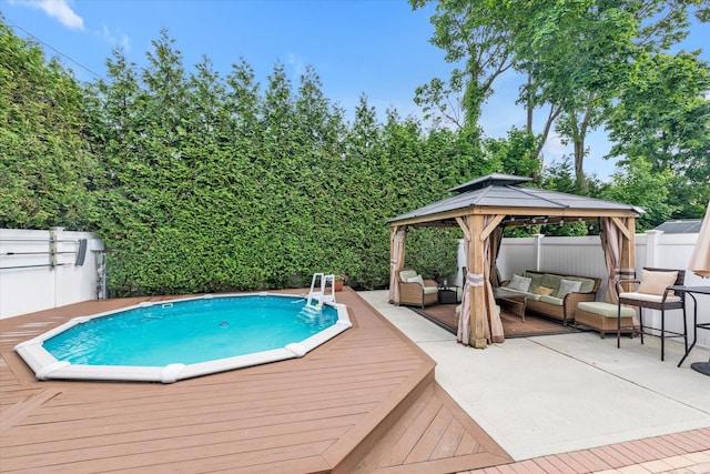 314 Oakview Ave, Oceanside, NY 11572 - outdoor pool featuring an outdoor hangout area, a gazebo, a wooden deck, and a fenced backyard