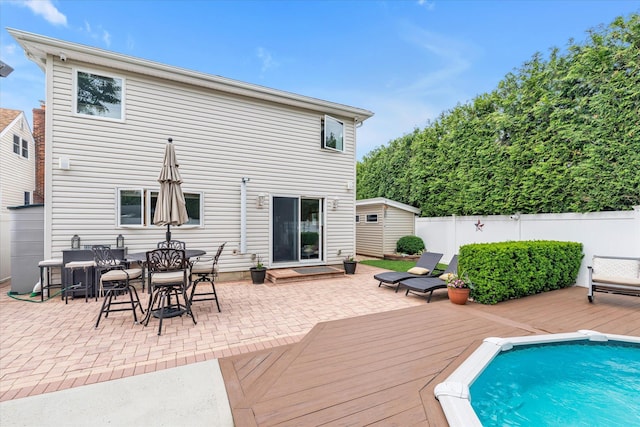 314 Oakview Ave, Oceanside, NY 11572 - back of property featuring a wooden deck and a patio