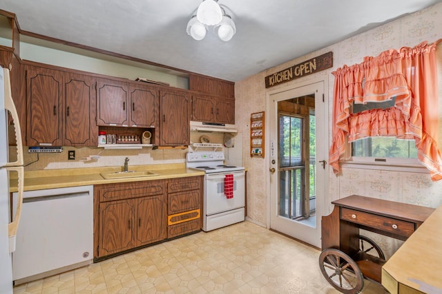 12 Ursular Ct, Smithtown, NY 11787 - kitchen featuring white appliances, under cabinet range hood, wallpapered walls, light countertops, and tasteful backsplash
