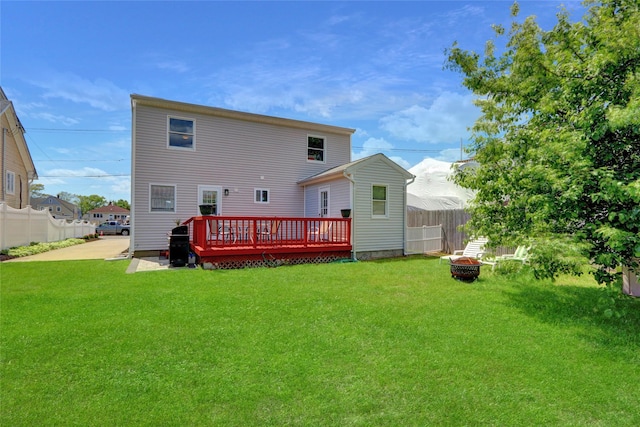674 Shore Rd, Lindenhurst, NY 11757 - rear view of house featuring a deck and an outdoor fire pit