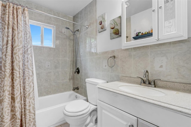 674 Shore Rd, Lindenhurst, NY 11757 - bathroom with shower / tub combo, vanity, toilet, tile walls, and tasteful backsplash