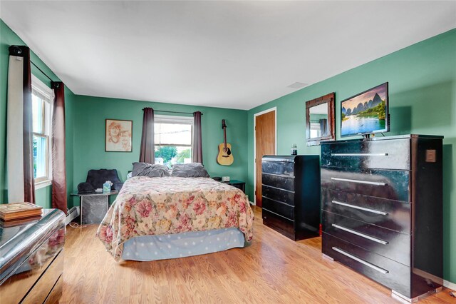 674 Shore Rd, Lindenhurst, NY 11757 - bedroom featuring light wood-type flooring