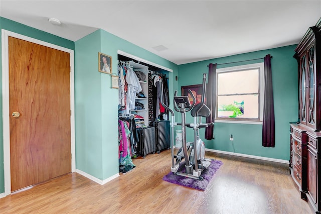 674 Shore Rd, Lindenhurst, NY 11757 - exercise area with wood finished floors and baseboards