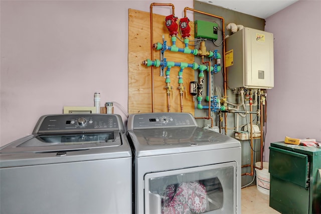 674 Shore Rd, Lindenhurst, NY 11757 - washroom with tankless water heater and washer and clothes dryer