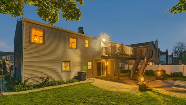 3123 Lydia Ln, Bellmore, NY 11710 - back of house with stairs, a wooden deck, a patio area, and a chimney