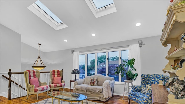 3123 Lydia Ln, Bellmore, NY 11710 - living room featuring a skylight, lofted ceiling, wood finished floors, and recessed lighting