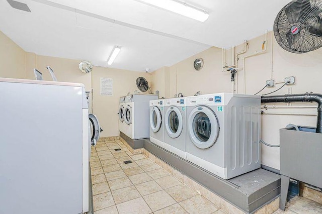 2121 Shore Pkwy Unit 2P, Brooklyn, NY 11214 - community laundry featuring washing machine and dryer and light tile patterned floors