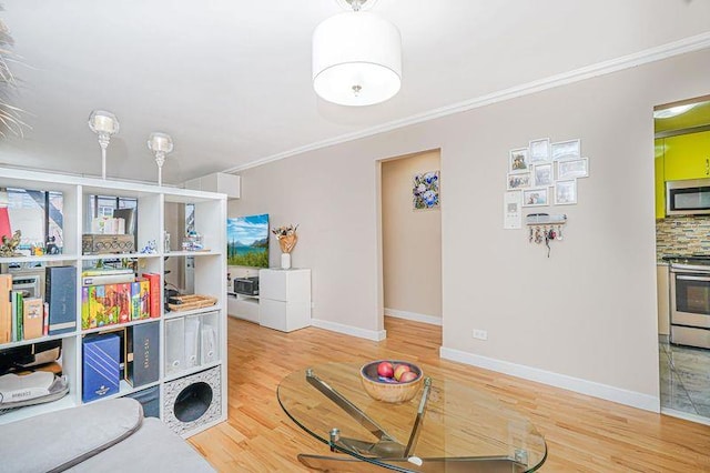 2121 Shore Pkwy Unit 2P, Brooklyn, NY 11214 - living room featuring wood finished floors, crown molding, and baseboards