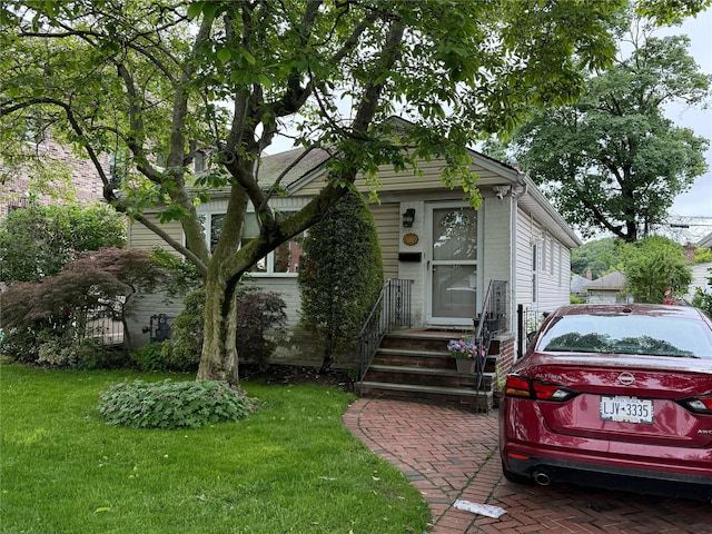56-09 230th St, Bayside, NY 11364 - view of front of house with a front lawn