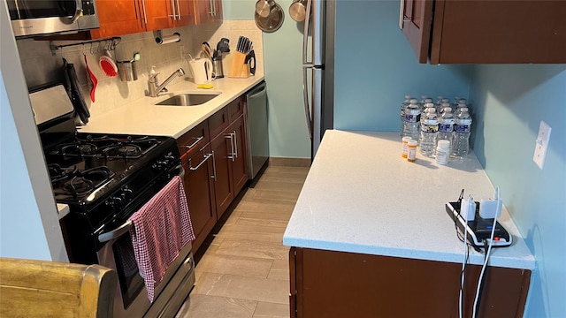 52-40 39th Dr Unit 9J, Woodside, NY 11377 - kitchen with range with gas cooktop, dishwasher, a sink, and backsplash
