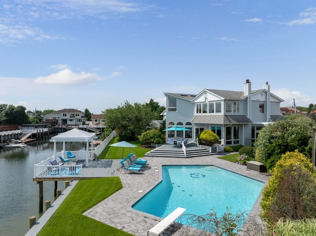 1416 Bay Blvd, Atlantic Beach, NY 11509 - back of house with a gazebo, an outdoor pool, a patio, and a fenced backyard