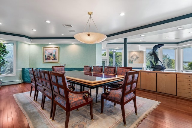 1416 Bay Blvd, Atlantic Beach, NY 11509 - dining space featuring wood-type flooring, decorative columns, a baseboard radiator, crown molding, and recessed lighting