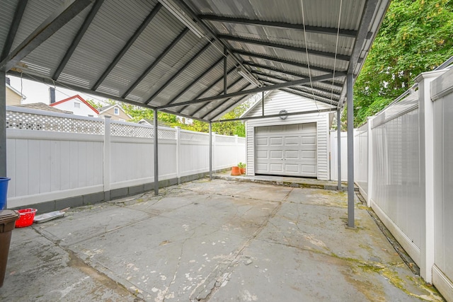 102-34 127th St, Richmond Hill S, NY 11419 - view of car parking featuring a garage and a fenced backyard