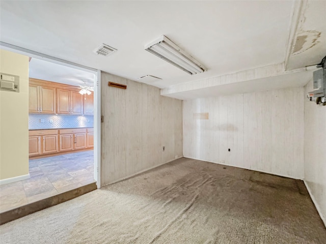 203 Dover Grn, Staten Island, NY 10312 - empty room with wooden walls, light carpet, and ceiling fan
