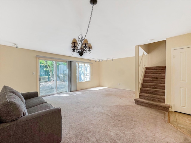203 Dover Grn, Staten Island, NY 10312 - unfurnished living room with stairs, carpet flooring, a chandelier, and track lighting