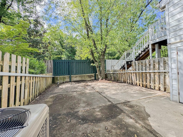 203 Dover Grn, Staten Island, NY 10312 - fenced backyard featuring central AC, a patio, and stairway
