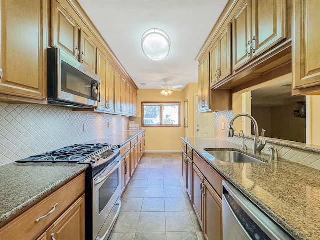 203 Dover Grn, Staten Island, NY 10312 - kitchen featuring appliances with stainless steel finishes, a sink, and backsplash