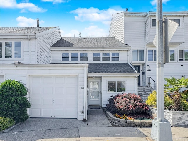 203 Dover Grn, Staten Island, NY 10312 - view of front of property featuring roof with shingles and driveway
