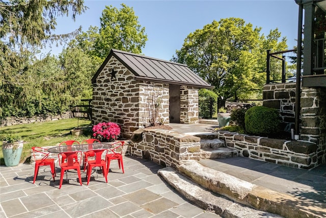 26 Roberson Ave, Pine Bush, NY 12566 - view of patio featuring outdoor dining space and an outdoor structure
