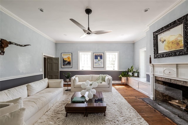 26 Roberson Ave, Pine Bush, NY 12566 - living room featuring dark wood-style floors, crown molding, ceiling fan, a fireplace, and a baseboard heating unit