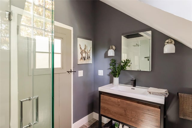 26 Roberson Ave, Pine Bush, NY 12566 - bathroom with vanity, a shower with shower door, baseboards, and vaulted ceiling