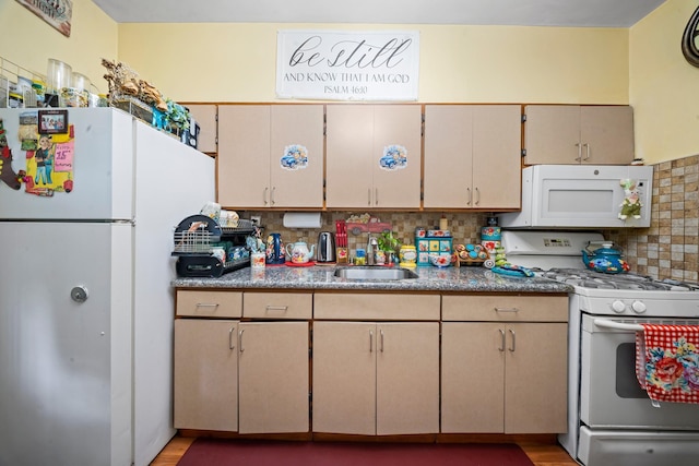 8564 79th St, Woodhaven, NY 11421 - kitchen with white appliances, a sink, tasteful backsplash, and light wood-style flooring