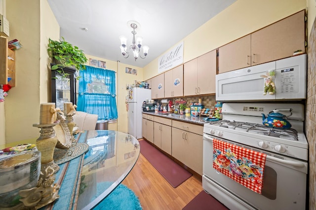 8564 79th St, Woodhaven, NY 11421 - kitchen with white appliances, a chandelier, light wood-type flooring, and backsplash