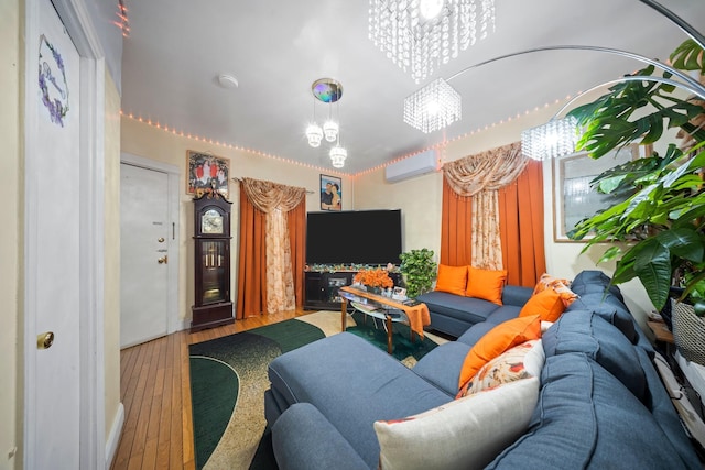 8564 79th St, Woodhaven, NY 11421 - living area with an AC wall unit, hardwood / wood-style floors, and a chandelier