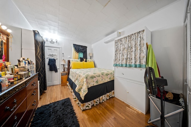 8564 79th St, Woodhaven, NY 11421 - bedroom with light wood finished floors and a wall unit AC