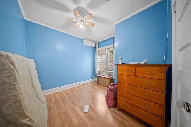 8564 79th St, Woodhaven, NY 11421 - bedroom featuring crown molding, an AC wall unit, baseboards, wood finished floors, and ceiling fan