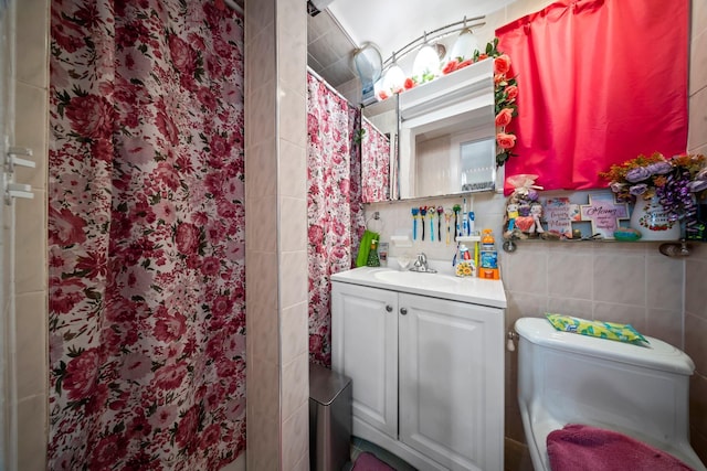 8564 79th St, Woodhaven, NY 11421 - full bathroom with vanity, a shower with curtain, toilet, and tile walls
