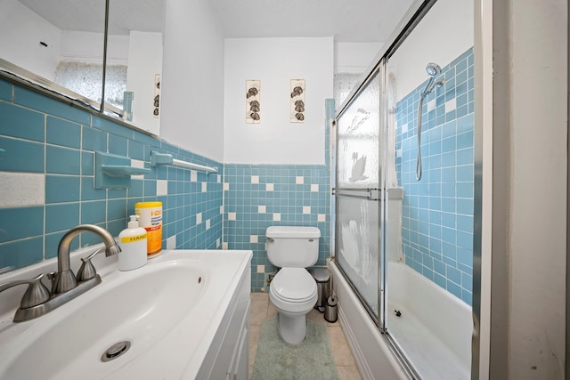 8564 79th St, Woodhaven, NY 11421 - full bathroom with toilet, combined bath / shower with glass door, plenty of natural light, tile patterned floors, and tile walls