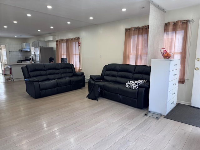 119-50 27th Ave, Flushing, NY 11354 - living room with light wood-style flooring and recessed lighting