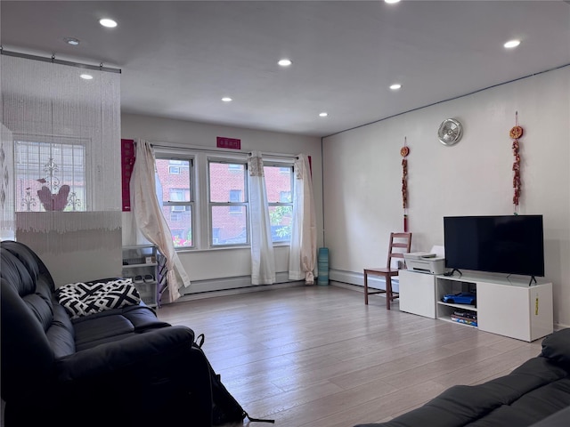 119-50 27th Ave, Flushing, NY 11354 - living area featuring wood finished floors, recessed lighting, and a baseboard radiator