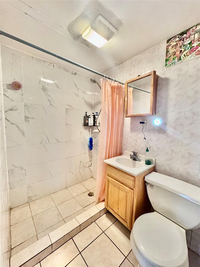 119-50 27th Ave, Flushing, NY 11354 - bathroom featuring a shower stall, vanity, toilet, tile patterned flooring, and tile walls