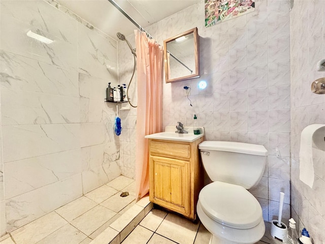 119-50 27th Ave, Flushing, NY 11354 - full bath with a tile shower, vanity, tile patterned flooring, toilet, and tile walls