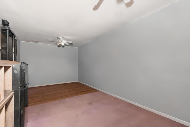 1340 Lombardy Blvd, Bay Shore, NY 11706 - unfurnished living room with ceiling fan, baseboards, and wood finished floors