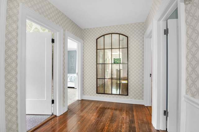 7 Middle Dr, Manhasset, NY 11030 - hallway featuring dark wood-type flooring, wallpapered walls, and baseboards