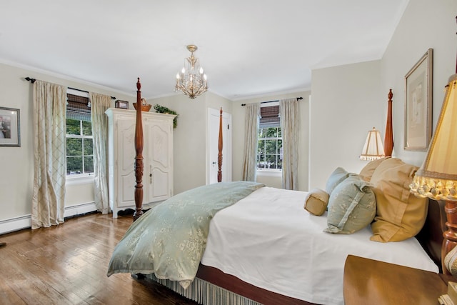 7 Middle Dr, Manhasset, NY 11030 - bedroom with a chandelier, wood finished floors, ornamental molding, and baseboard heating