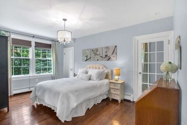 7 Middle Dr, Manhasset, NY 11030 - bedroom featuring a baseboard heating unit, a chandelier, and dark wood-style floors