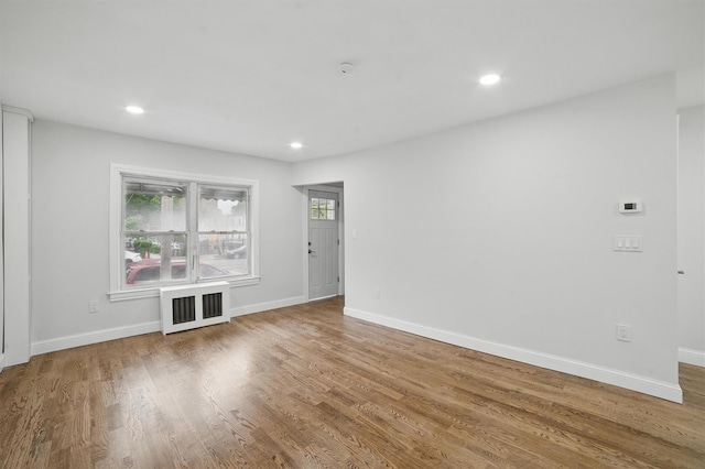 4163 Laconia Ave, Bronx, NY 10466 - unfurnished room featuring radiator, wood finished floors, baseboards, and recessed lighting