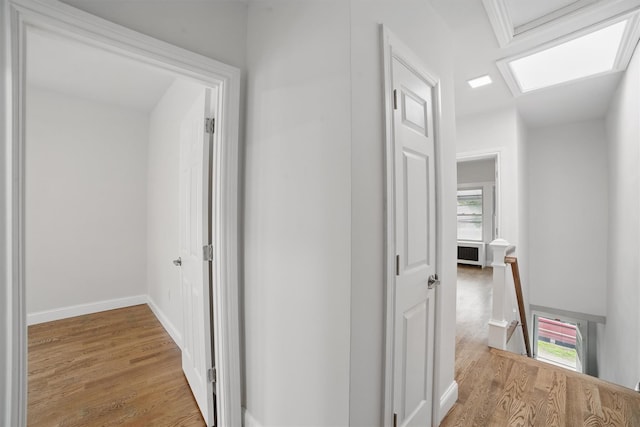 4163 Laconia Ave, Bronx, NY 10466 - hallway with an upstairs landing, light wood-style flooring, and baseboards