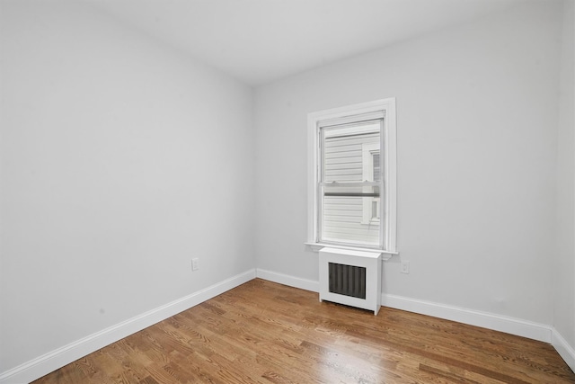 4163 Laconia Ave, Bronx, NY 10466 - unfurnished room featuring baseboards, radiator, and light wood-type flooring