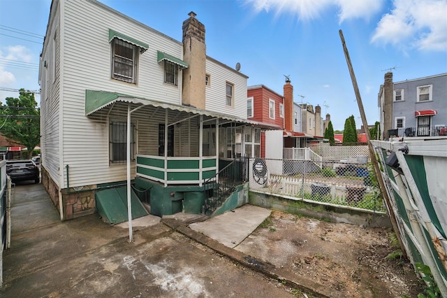4163 Laconia Ave, Bronx, NY 10466 - back of house with a residential view and a chimney