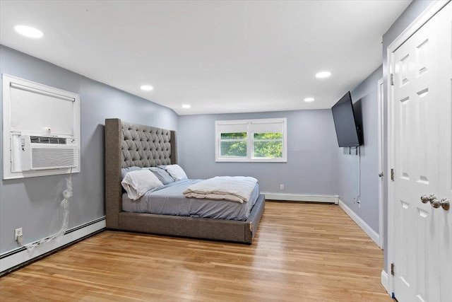 610 Farm To Market Rd, Brewster, NY 10509 - bedroom with baseboard heating, light wood-style flooring, recessed lighting, and cooling unit