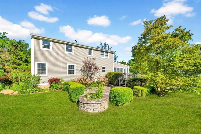 610 Farm To Market Rd, Brewster, NY 10509 - back of property with a yard, stairs, and a deck