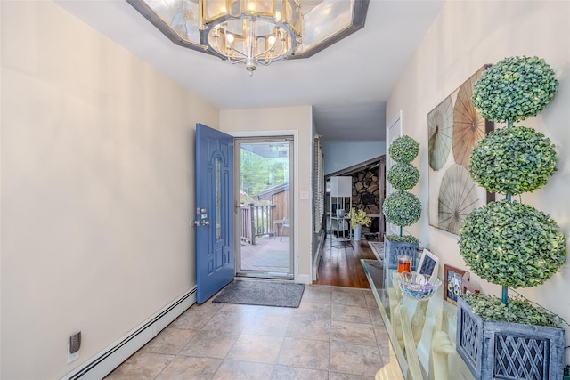 45 Broadview Dr, Commack, NY 11725 - entryway featuring a chandelier, a baseboard heating unit, baseboards, and light stone finish floors
