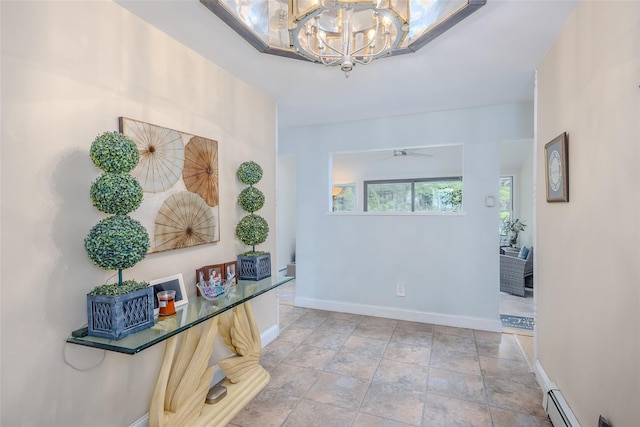 45 Broadview Dr, Commack, NY 11725 - hall with baseboards, a chandelier, and stone finish floors