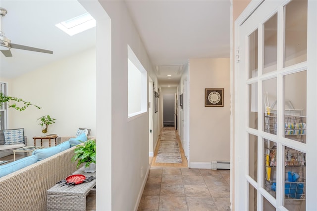 45 Broadview Dr, Commack, NY 11725 - hallway with a baseboard radiator, baseboards, and a skylight